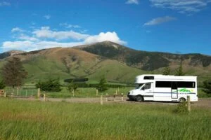Best family RVs for 2026 showcasing spacious travel trailers and motorhomes with bunkhouse layouts, multiple sleeping areas, modern kitchens, and family-friendly features