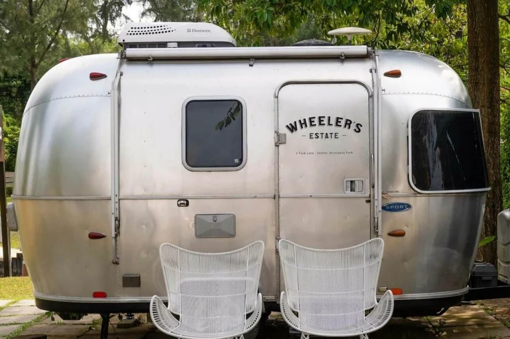 Best lightweight toy haulers showing compact RV trailers with garage space for ATVs, motorcycles, and gear, featuring lightweight towing and off-grid camping capability