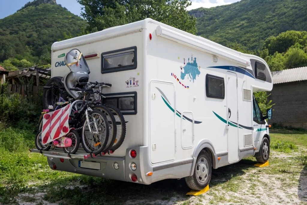 Buying a used RV guide showing tips for inspection, pricing, negotiation, and selecting the right pre-owned motorhome or camper