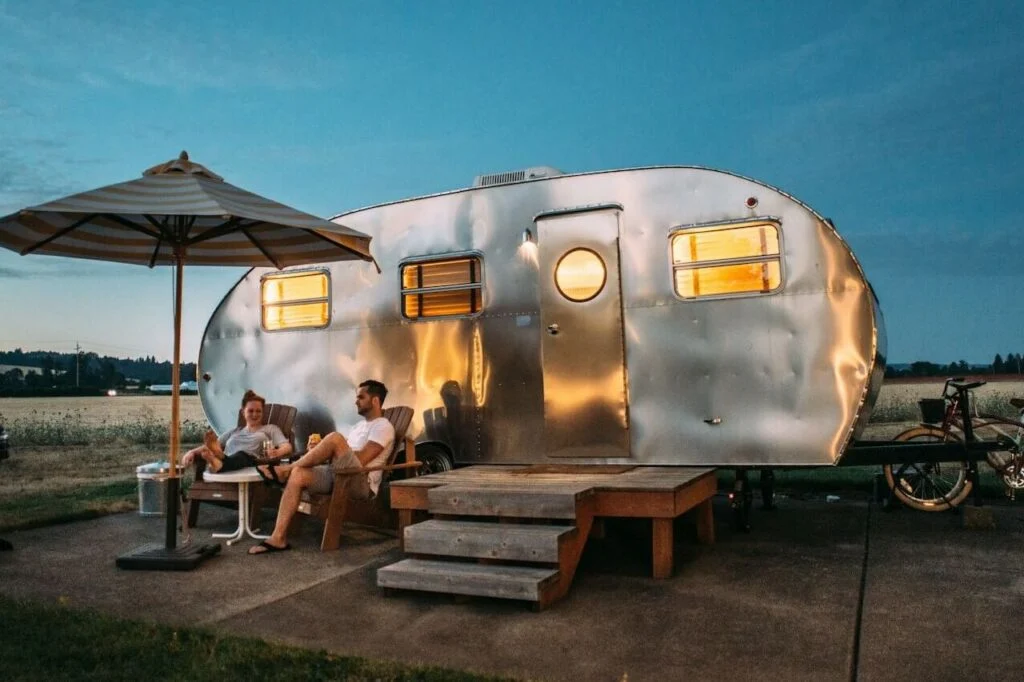 A renovated camper interior showcasing modern upgrades such as updated furnishings, stylish finishes, improved lighting, and a redesigned layout for comfortable RV living in 2026.