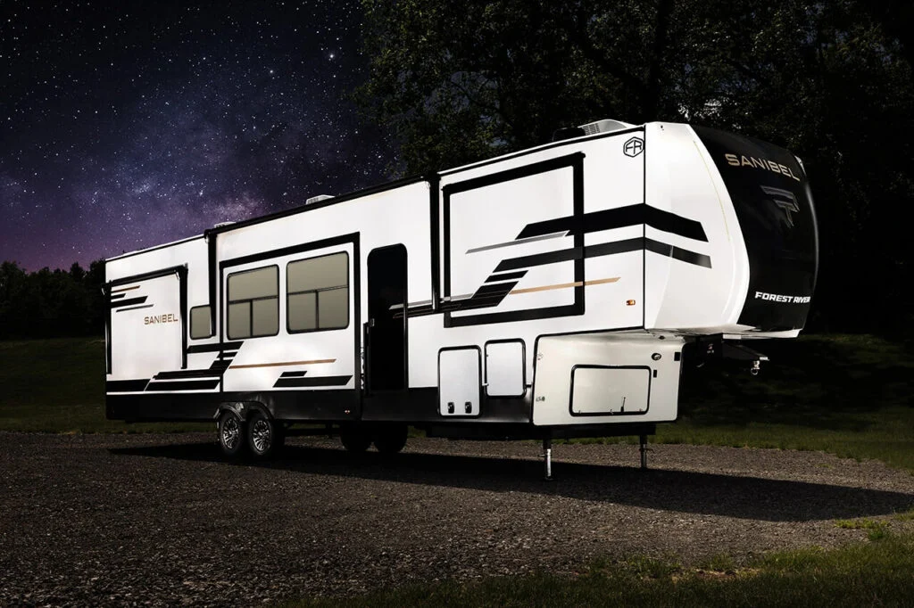 A Sanibel RV luxury fifth wheel interior showing spacious living areas, modern kitchen, and upscale furnishings designed for comfortable RV living and travel in 2026.