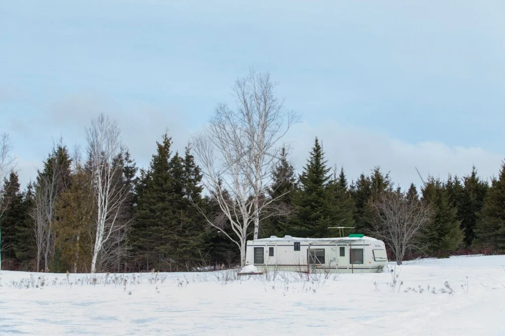 Step by step preparation guide on how to winterize your RV showing key processes such as draining water systems, protecting plumbing, insulating components, and preventing cold weather damage